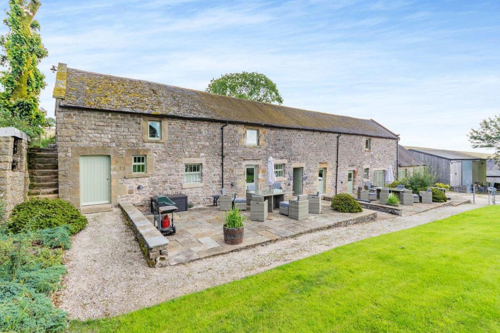 Traditional stone cottages at Broad Ecton Farm in the White Peak.